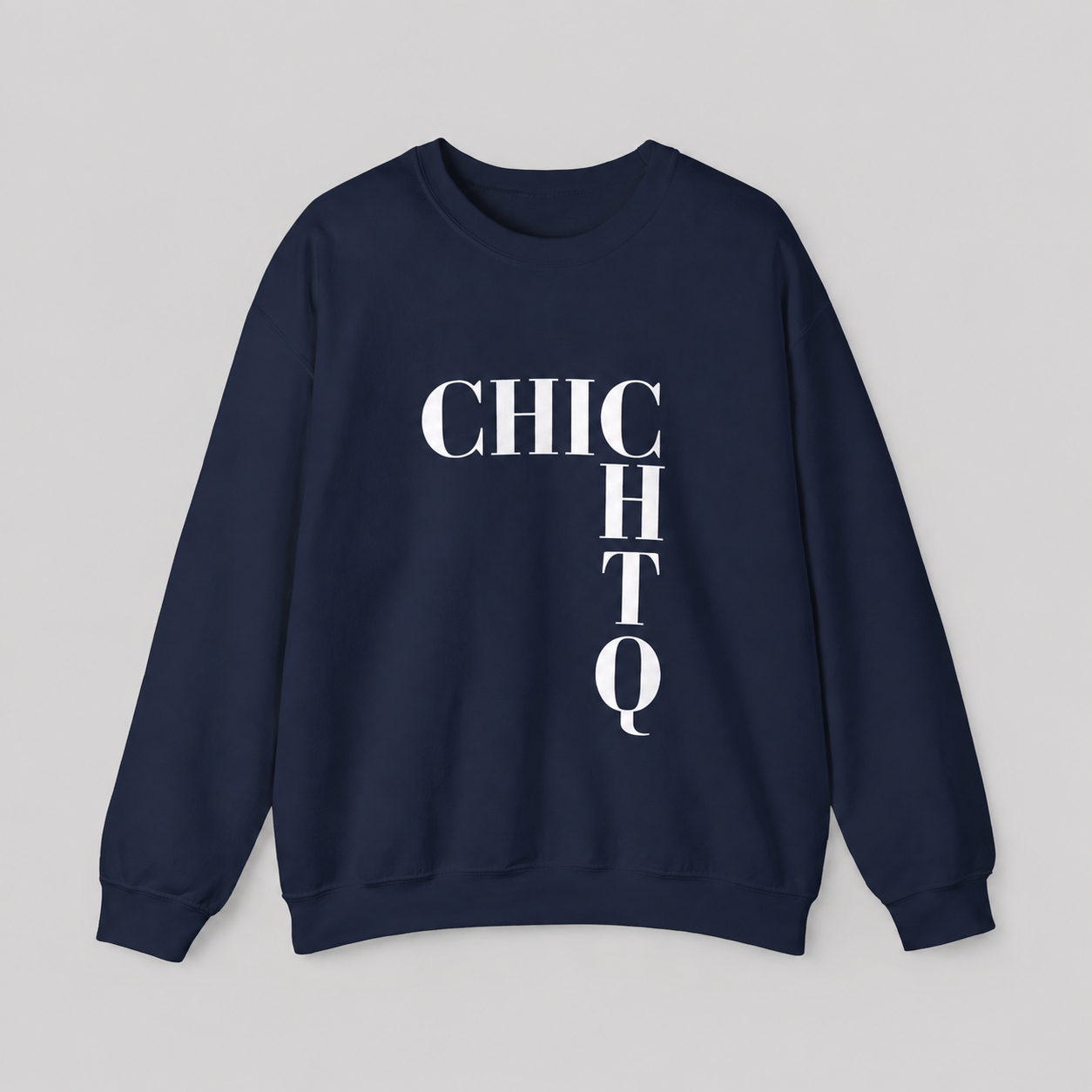 A navy blue crewneck sweatshirt with a bold white graphic print spelling 'CHIC CHTQ' vertically on the front, displayed against a neutral gray background.