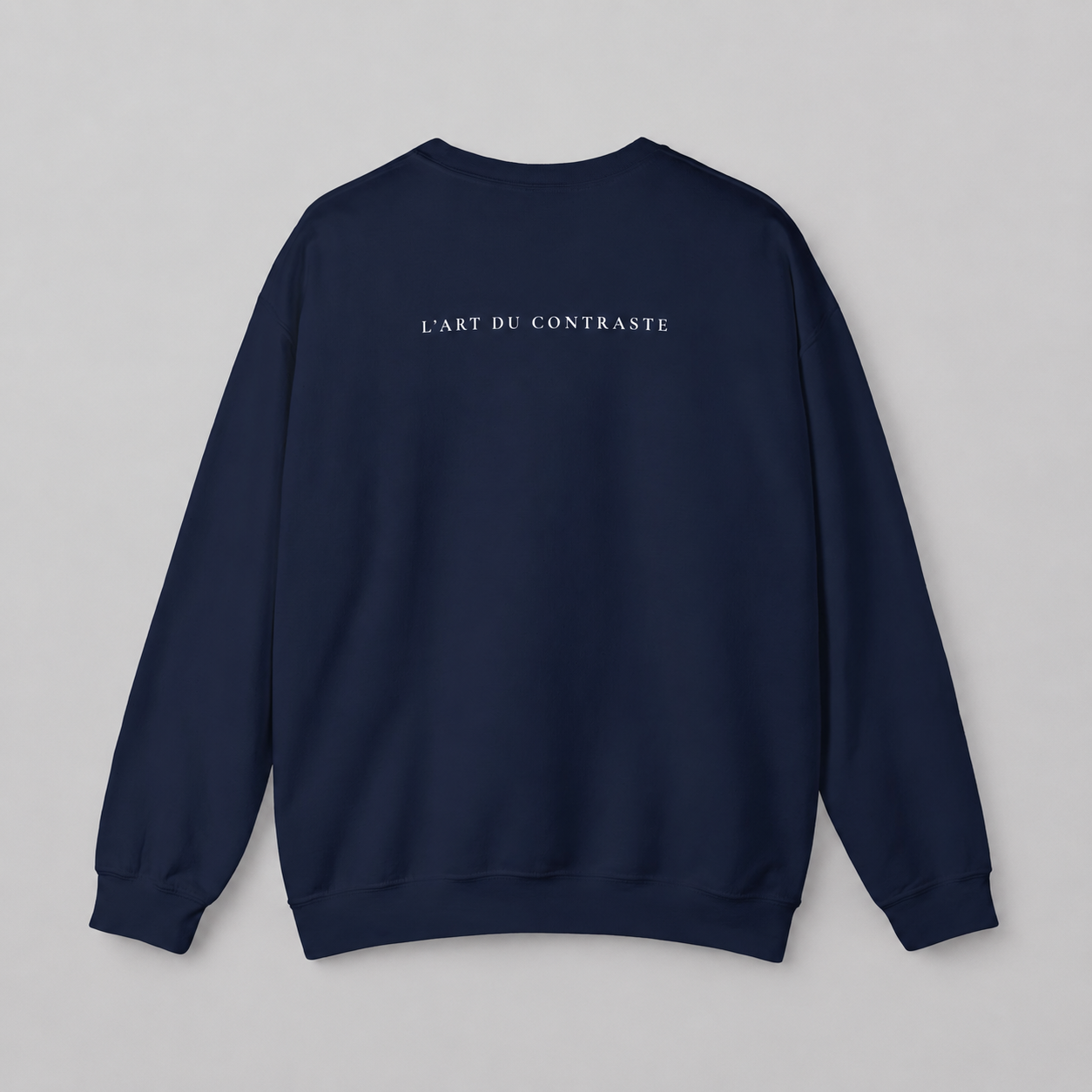Navy blue sweatshirt from back with text 'L'Art du contraste'