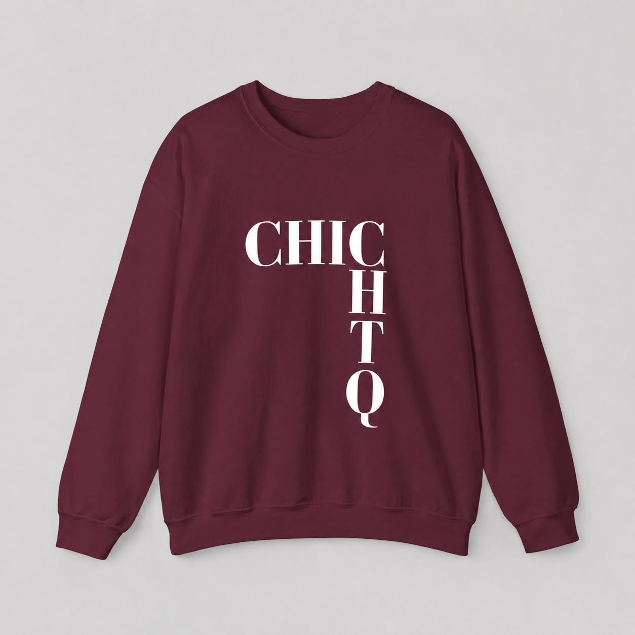 A maroon crewneck sweatshirt with 'CHICHTQ' printed in bold white letters on the front, laid flat against a light gray background.