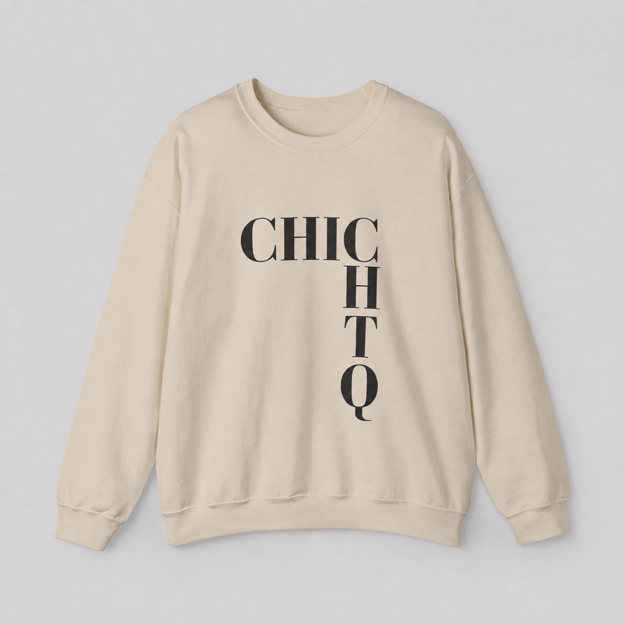 A cream-colored crewneck sweatshirt with the word 'CHICHTQ' printed vertically in black serif letters across the chest, laid flat on a light gray background.