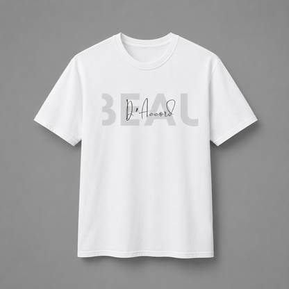White short-sleeve crewneck T-shirt featuring a gray “BEAU” graphic with a white cursive “D’Accord” overlay, displayed against a neutral gray studio background.