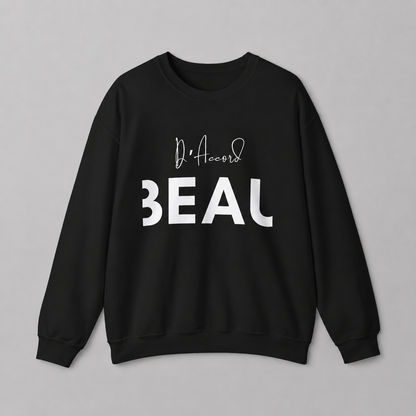 A black crewneck sweatshirt featuring a black “D’accord” script graphic above bold “BEAU” lettering across the chest, displayed against a neutral light gray background.