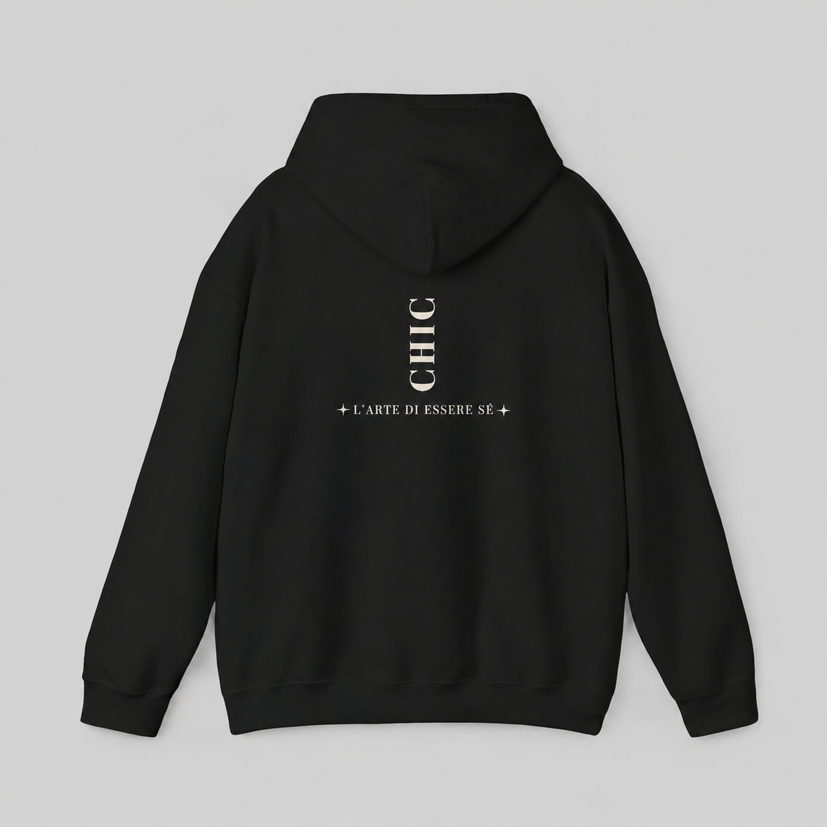 A black pullover hoodie featuring a dark brown vertical CHIC back graphic and French-inspired typography, photographed from behind against a clean light gray studio background.