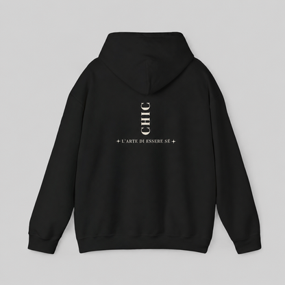 A black pullover hoodie featuring a dark brown vertical CHIC back graphic and French-inspired typography, photographed from behind against a clean light gray studio background.