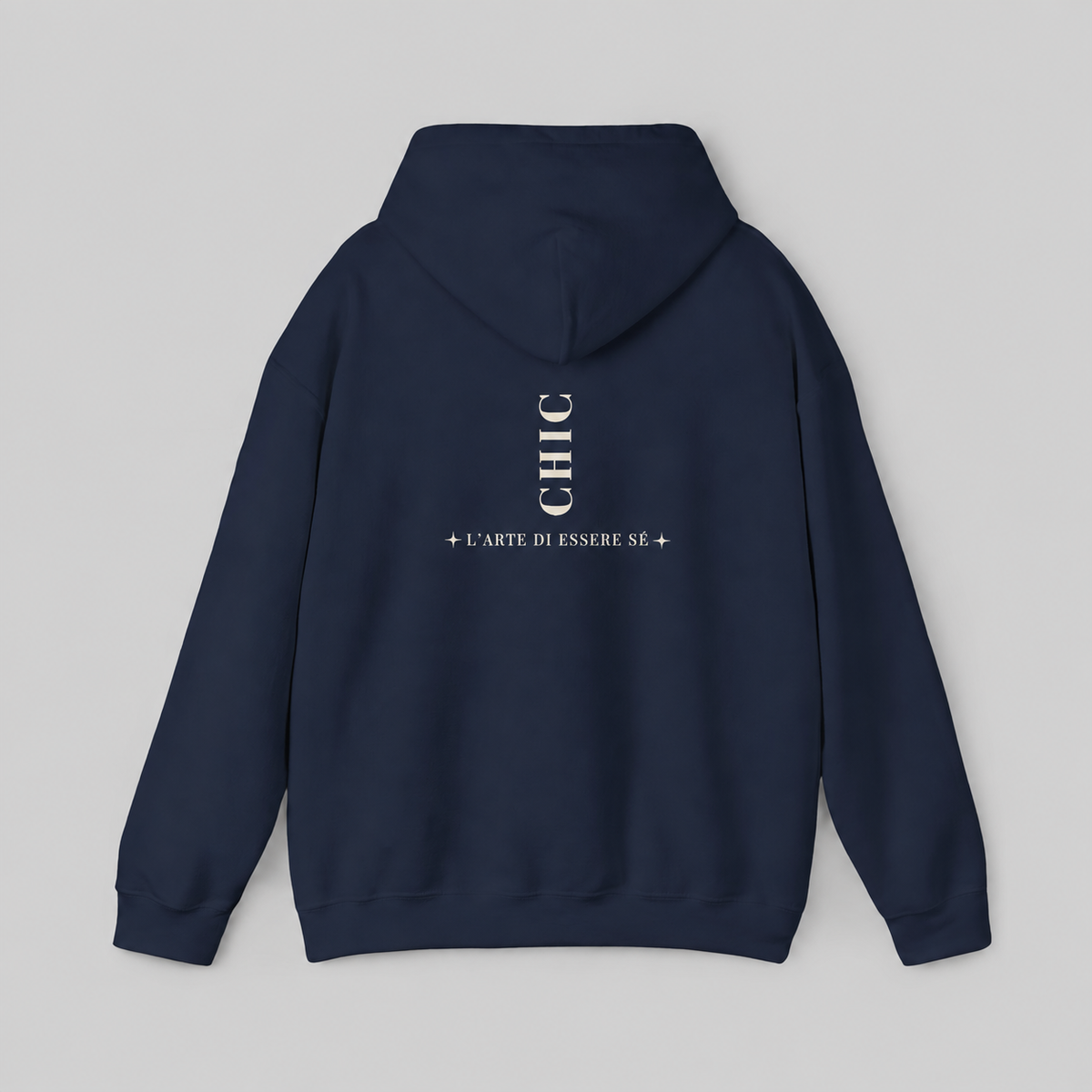 A navy blue pullover hoodie featuring a dark brown vertical CHIC back graphic and French-inspired typography, photographed from behind against a clean light gray studio background.