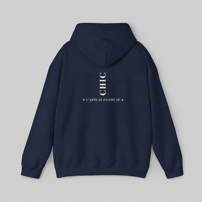 A navy blue pullover hoodie featuring a dark brown vertical CHIC back graphic and French-inspired typography, photographed from behind against a clean light gray studio background.