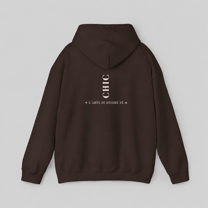 A brown pullover hoodie featuring a dark brown vertical CHIC back graphic and French-inspired typography, photographed from behind against a clean light gray studio background.