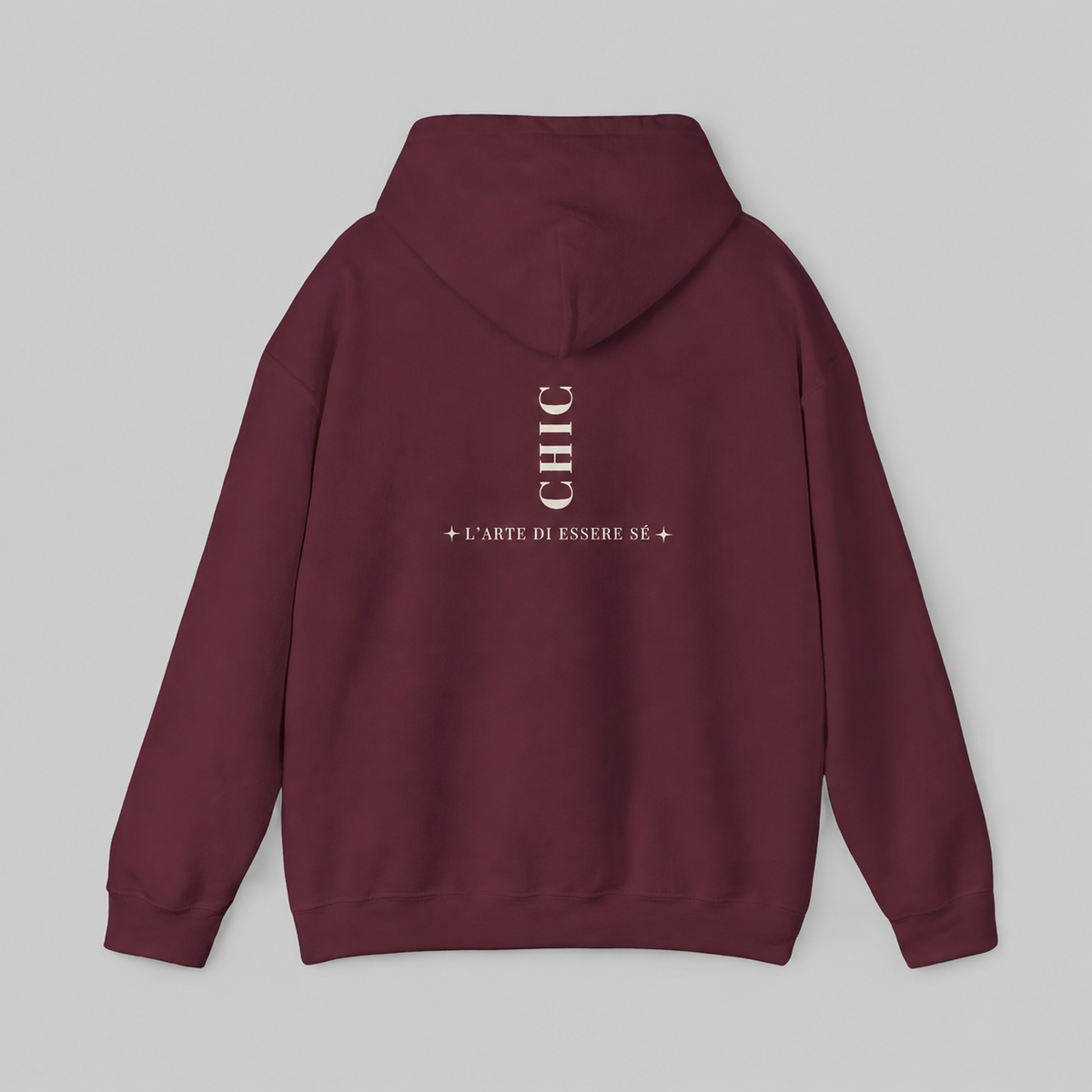 A maroon pullover hoodie featuring a dark brown vertical CHIC back graphic and French-inspired typography, photographed from behind against a clean light gray studio background.