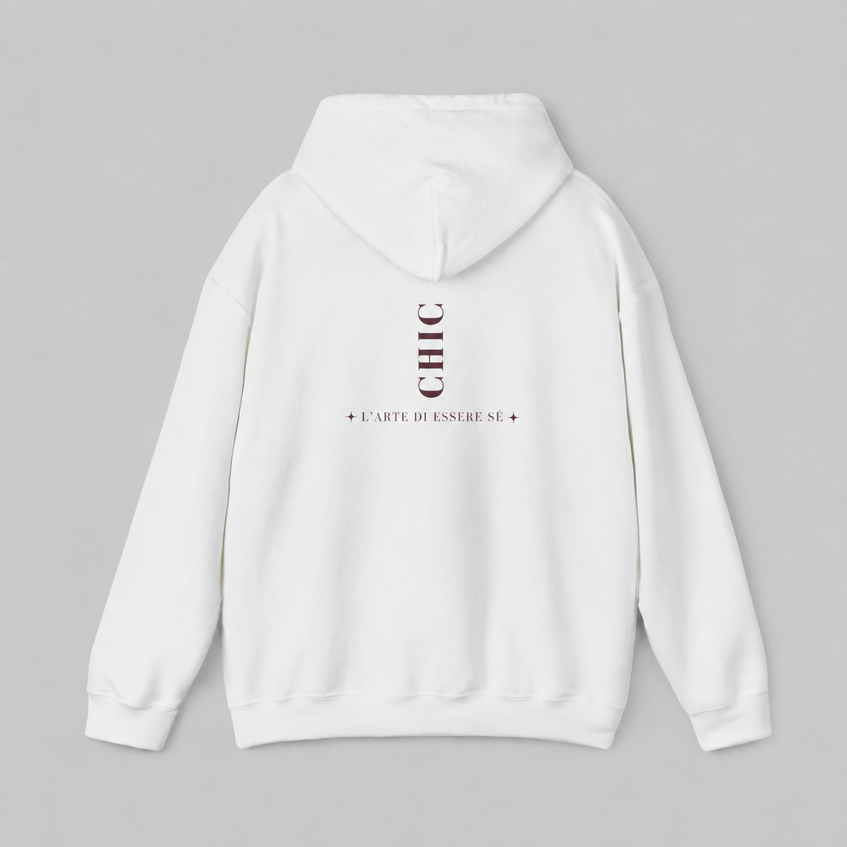 A white pullover hoodie featuring a dark brown vertical CHIC back graphic and French-inspired typography, photographed from behind against a clean light gray studio background.