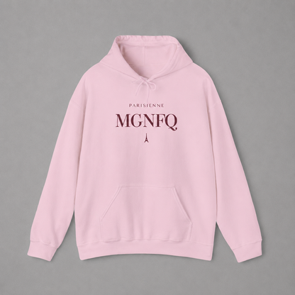 Light pink PARISIENNE MGNFQ graphic hoodie featuring cream typography and a small Eiffel Tower detail, shown against a light gray studio background.