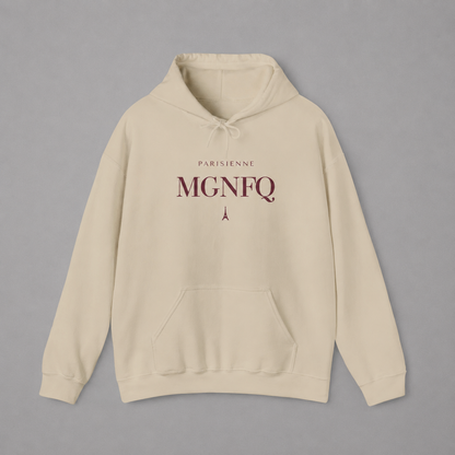 Cream-colored PARISIENNE MGNFQ graphic hoodie featuring cream typography and a small Eiffel Tower detail, shown against a light gray studio background.