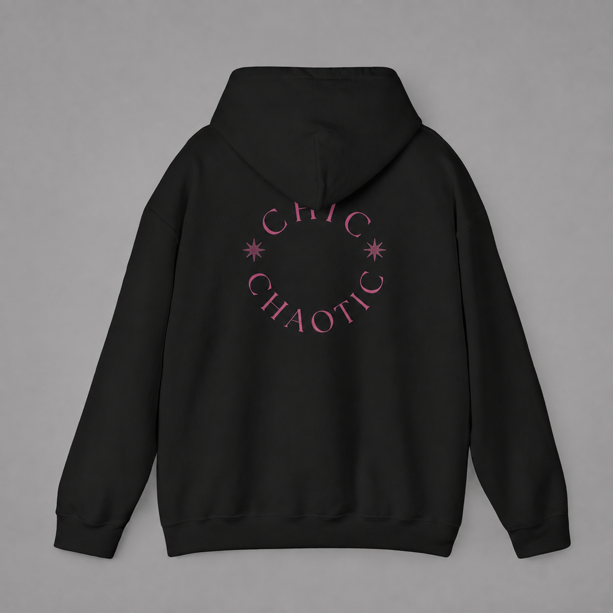 Black pullover hoodie shown from the back, featuring a dark burgundy circular CHIC CHAOTIC graphic with subtle star accents against a neutral gray studio background.