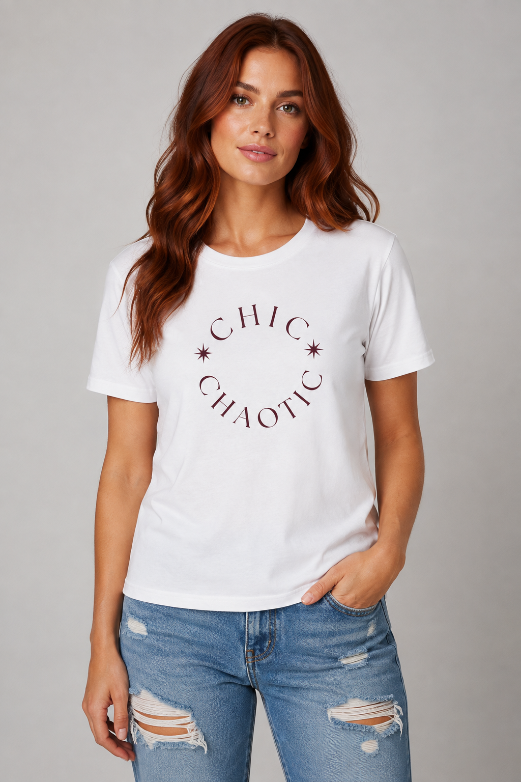Woman wearing a white Chic and Chaotic graphic T-shirt with black typography, styled for a casual everyday look.