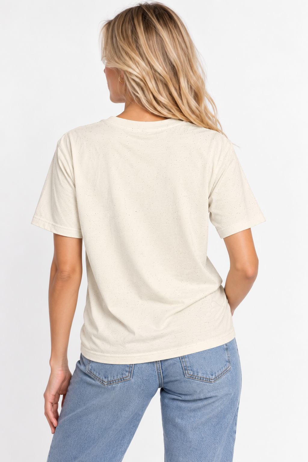 A woman viewed from the back wearing the CHIC by CHTQ Design Women’s Graphic T-Shirt in light beige with light blue jeans against a clean white studio background.
