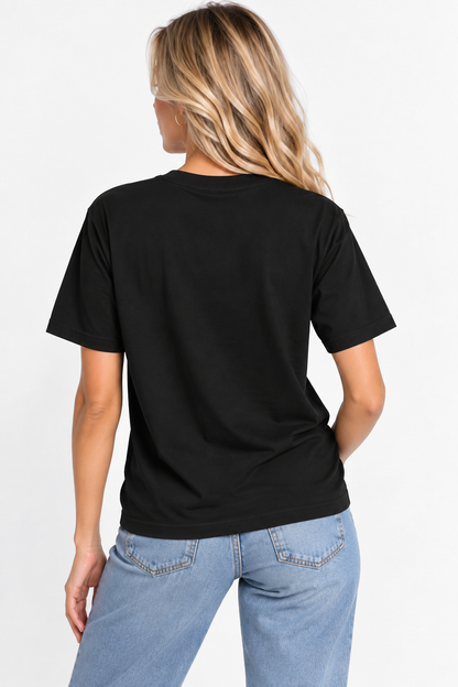 A woman viewed from the back wearing the CHIC by CHTQ Design Women’s Graphic T-Shirt in black with light blue jeans against a clean white studio background.