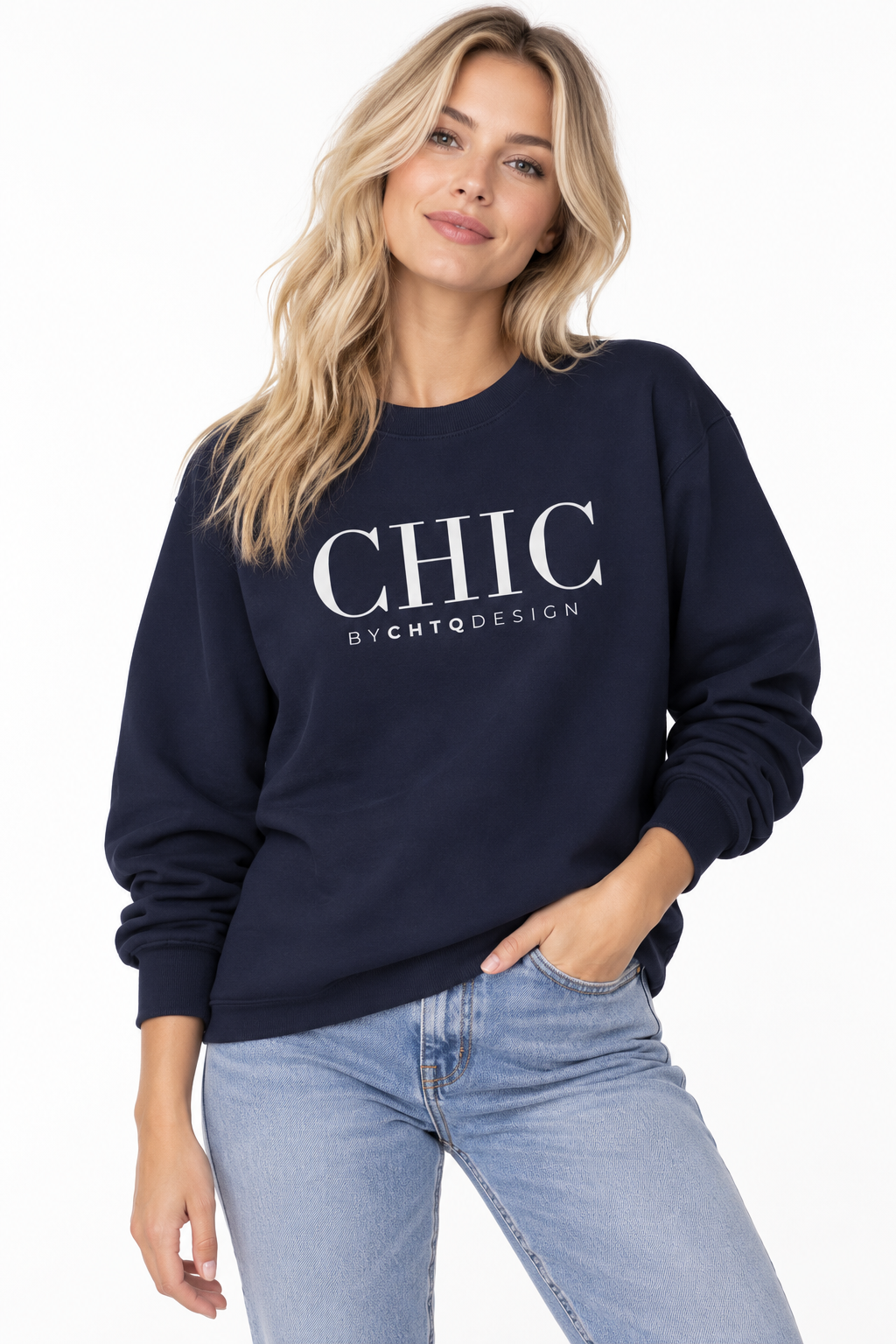 Woman wearing a navy CHIC by CHTQ Design crewneck sweatshirt with a white graphic print, paired with light blue jeans against a white studio background.