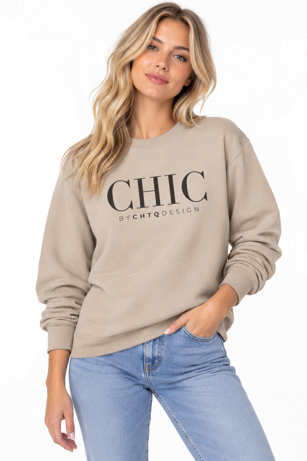 Woman wearing a beige CHIC by CHTQ Design crewneck sweatshirt with a black graphic print, paired with light blue jeans against a white studio background.