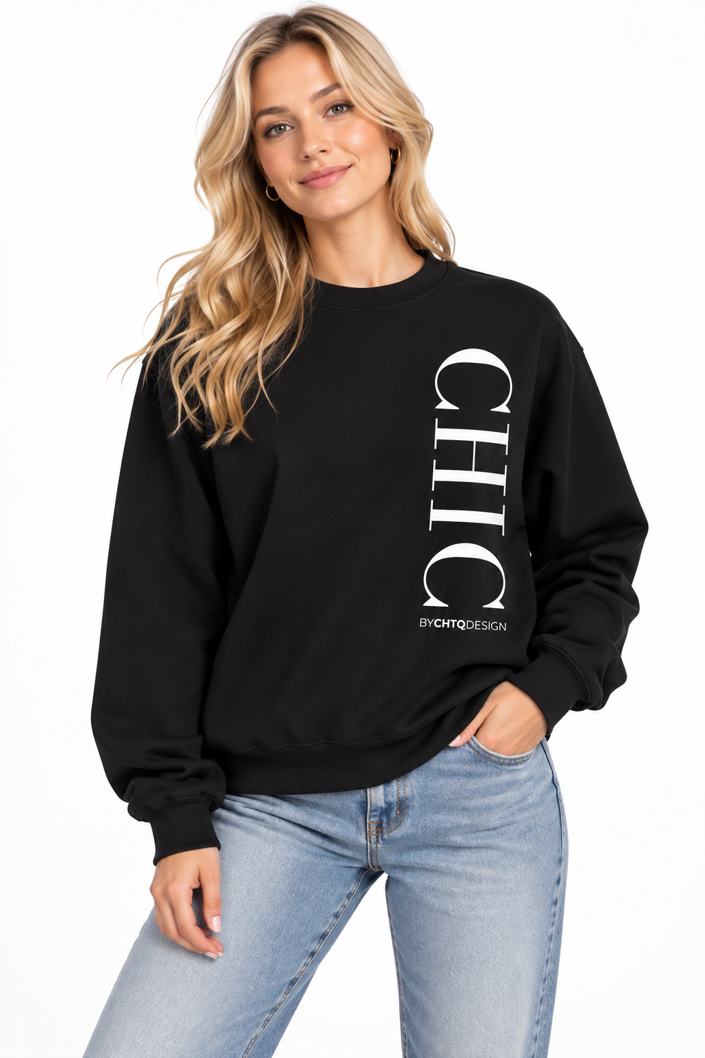 A woman wearing a black crewneck sweatshirt with a large vertical white 'CHIC' graphic and smaller 'BY CHTQ DESIGN' text, paired with light blue jeans against a plain white background.