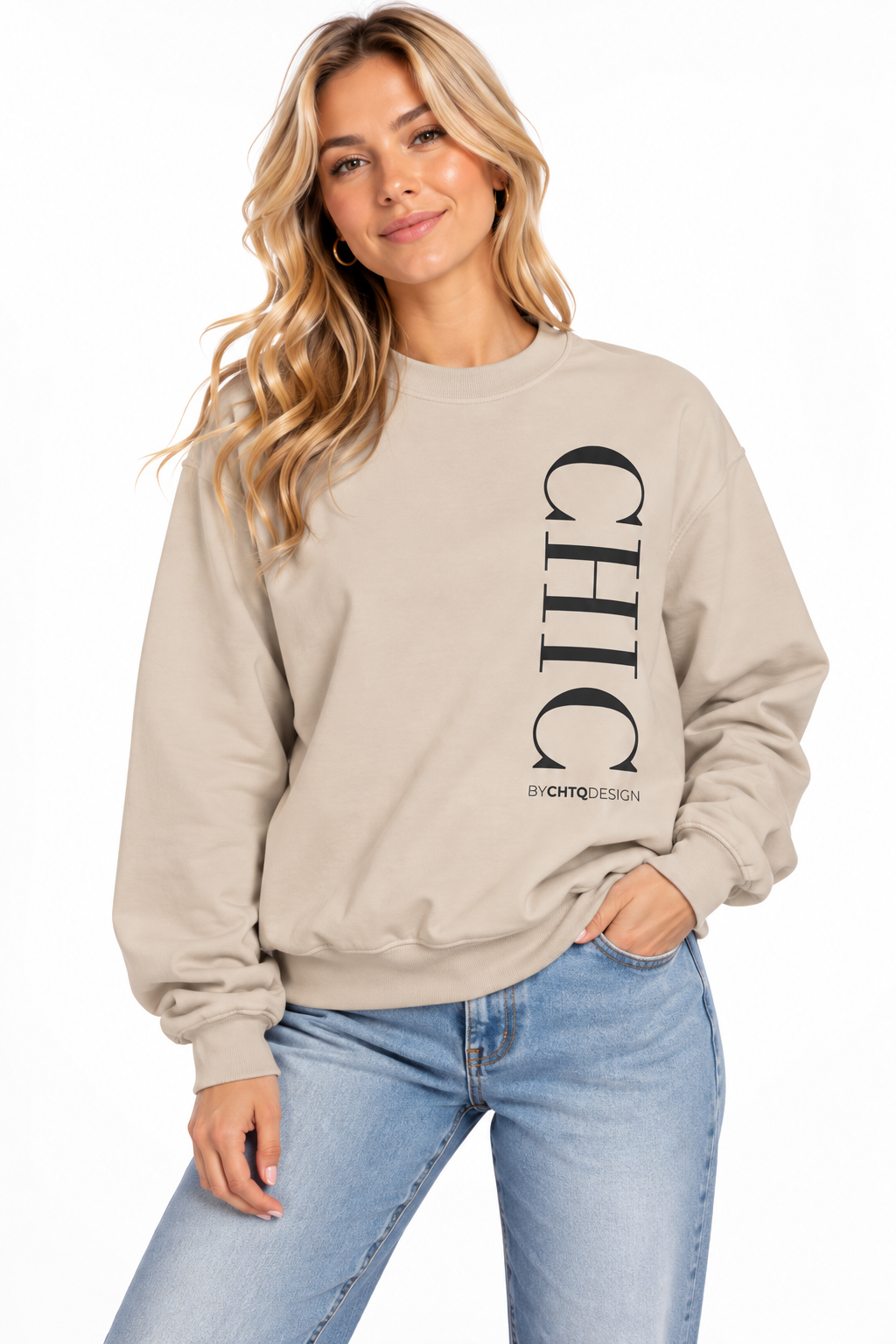 A woman wearing a beige crewneck sweatshirt with a large vertical black 'CHIC' graphic and smaller 'BY CHTQ DESIGN' text, paired with light blue jeans against a plain white background.
