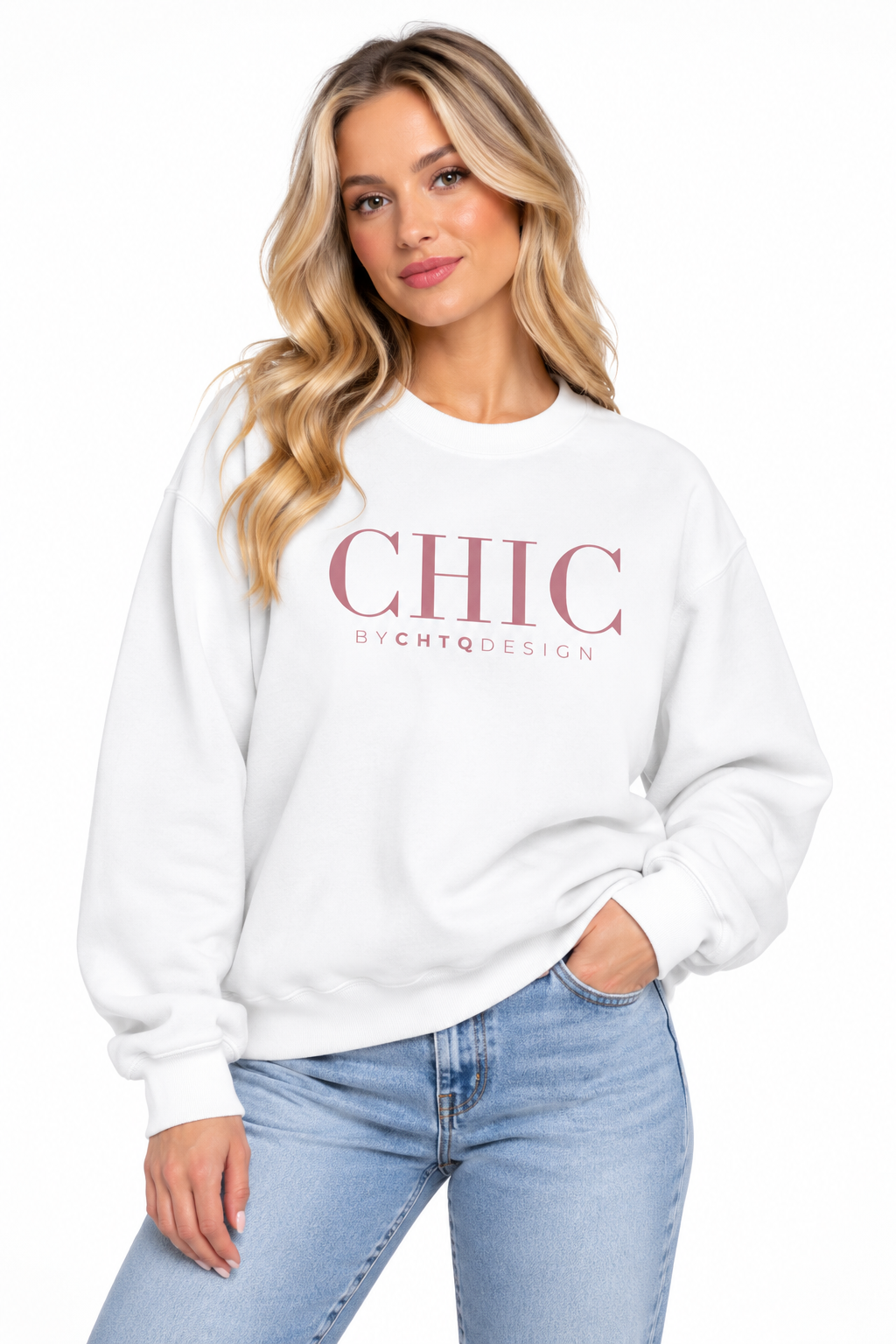 A woman wearing a white CHIC BY CHTQ DESIGN Crewneck Sweatshirt with a pink graphic across the chest, paired with light-wash blue jeans against a clean white studio background.