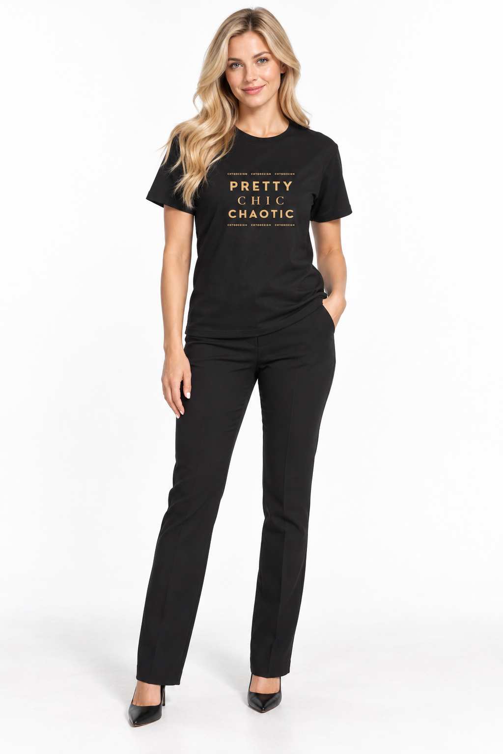 A woman modeling a black short-sleeve crewneck t-shirt with gold text that reads 'PRETTY CHIC Chaotic' and matching black pants against a plain white studio background.