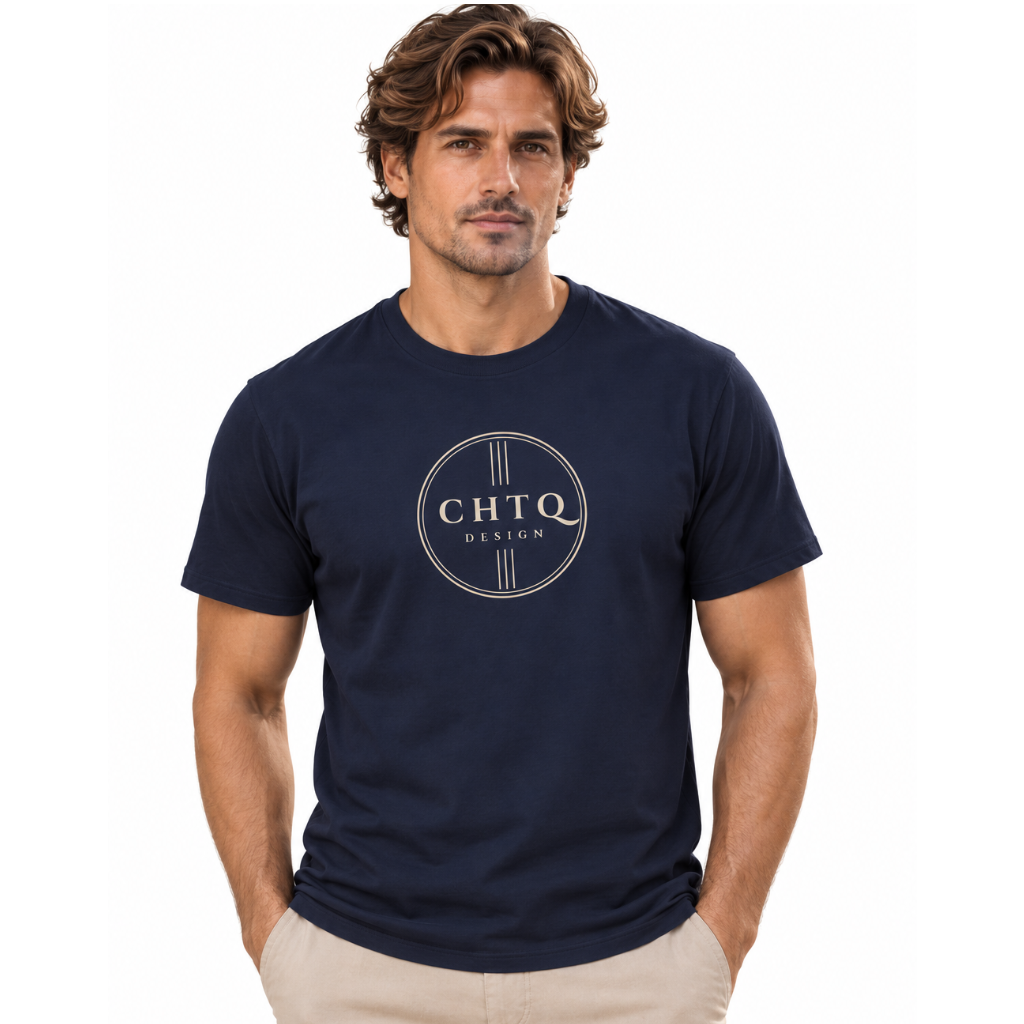 A man wearing a navy blue crewneck t-shirt with a circular 'CHTQ DESIGN' logo printed on the chest, paired with beige pants, against a plain white background.