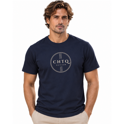 A man wearing a navy blue crewneck t-shirt with a circular 'CHTQ DESIGN' logo printed on the chest, paired with beige pants, against a plain white background.