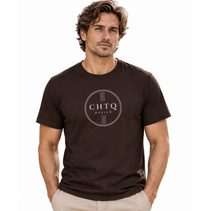 A man wearing a dark brown crewneck t-shirt with a circular 'CHTQ DESIGN' logo printed on the chest, paired with beige trousers, against a plain white background.