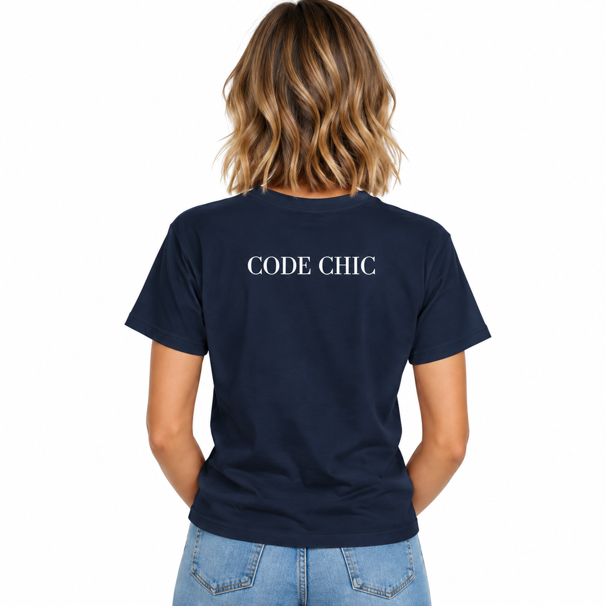 A woman viewed from the back wearing a navy blue short-sleeve T-shirt with the words 'CODE CHIC' printed in white across the upper back, paired with light blue jeans on a plain white background.