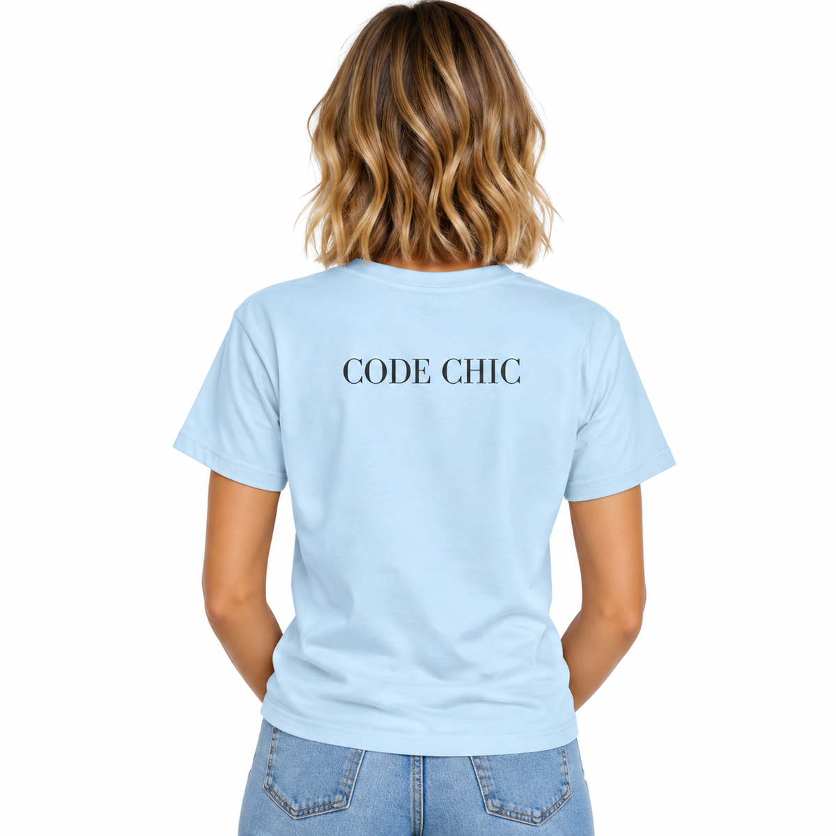 A woman viewed from the back wearing a light blue short-sleeve T-shirt with the words 'CODE CHIC' printed in white across the upper back, paired with light blue jeans on a plain white background.