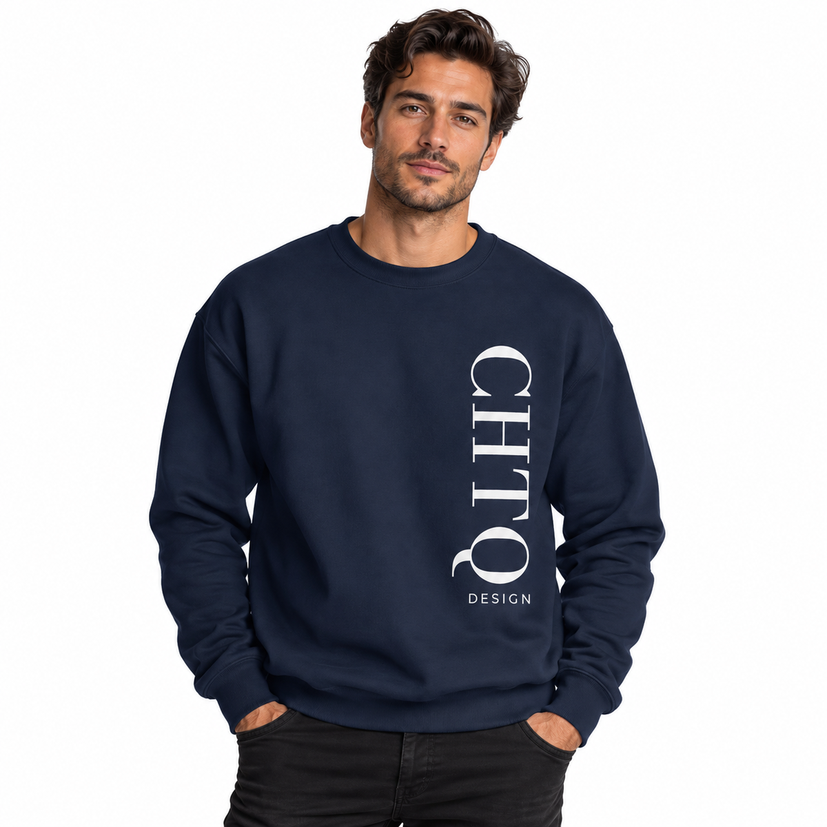 A man wearing a navy-colored crewneck sweatshirt with a vertical white CHTQ DESIGN graphic on the front, paired with black jeans against a plain white studio background.