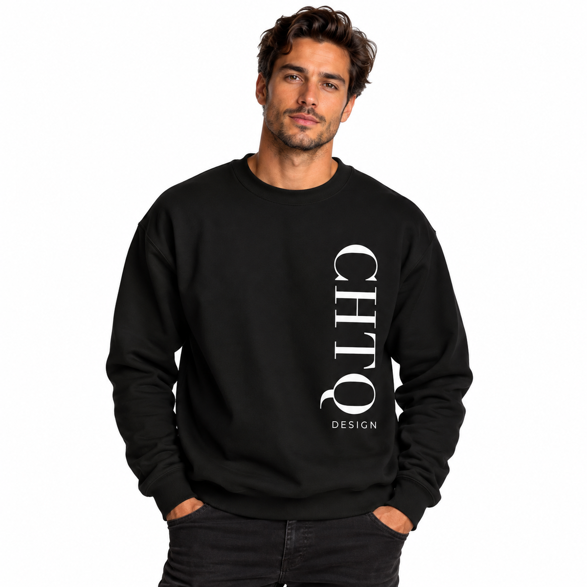 A man wearing a black-colored crewneck sweatshirt with a vertical white CHTQ DESIGN graphic on the front, paired with black jeans against a plain white studio background.