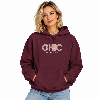 Woman wearing CHIC D’Accord graphic hoodie in maroon with light denim jeans