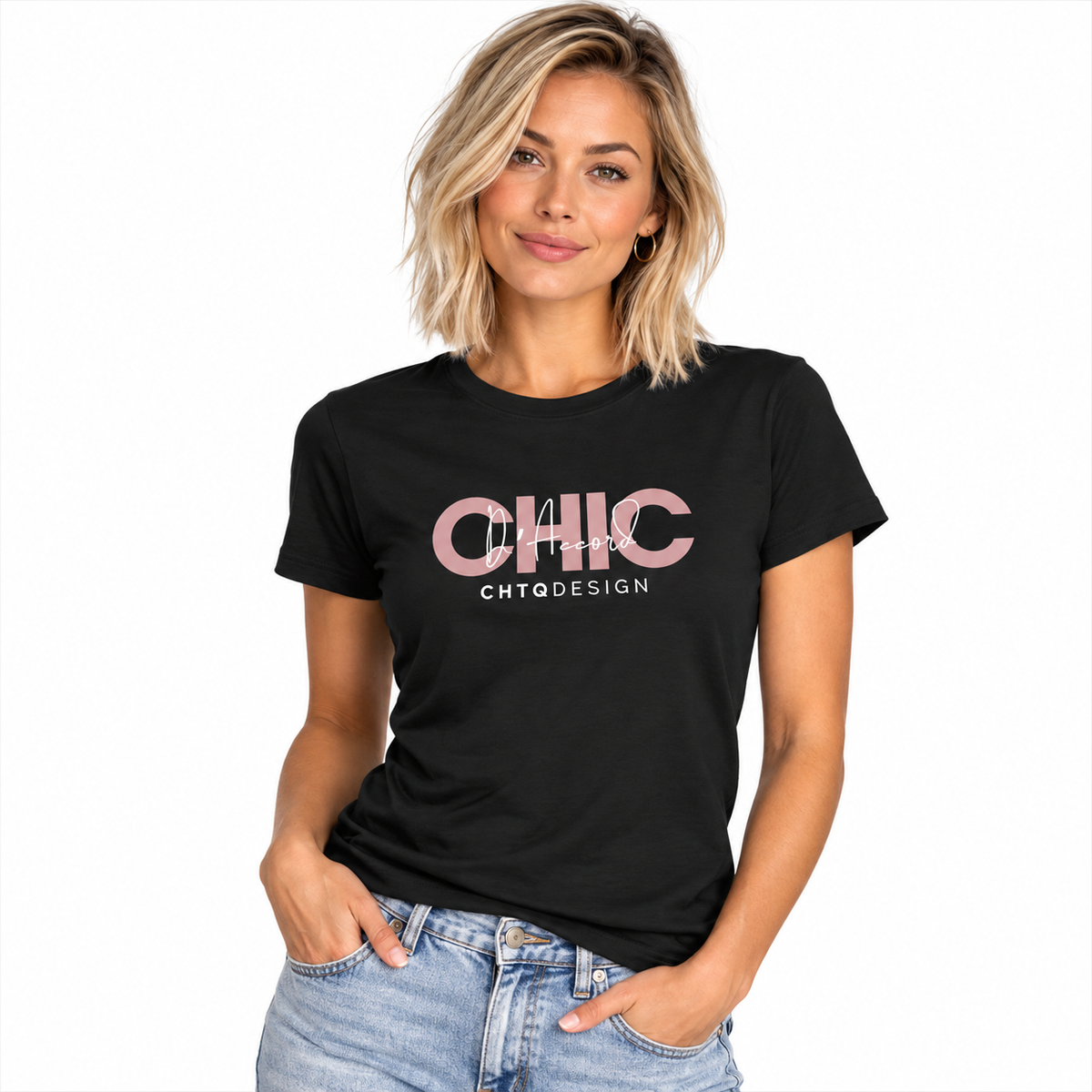 A woman modeling a black short-sleeve graphic t-shirt with 'CHIC D'Accord CHTQ Design' printed in pink and white, paired with light-wash blue jeans against a plain white background.