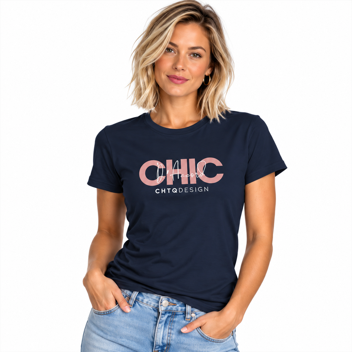 A woman modeling a navy blue short-sleeve graphic t-shirt with 'CHIC D'Accord CHTQ Design' printed in pink and white, paired with light-wash blue jeans against a plain white background.
