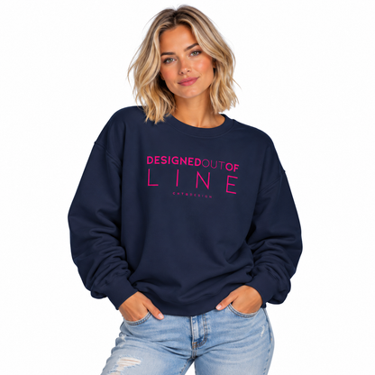 Woman wearing a navy Designed Out of Line crewneck sweatshirt by CHTQ Design with pink graphic text.