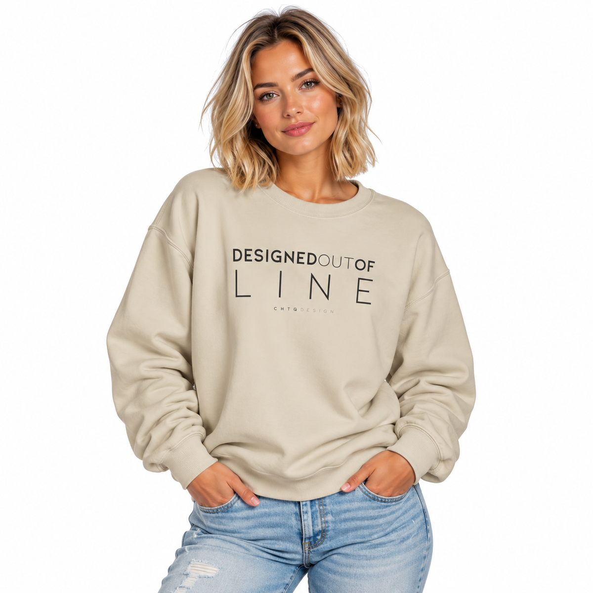 Woman wearing a sand Designed Out of Line crewneck sweatshirt by CHTQ Design with black graphic text.
