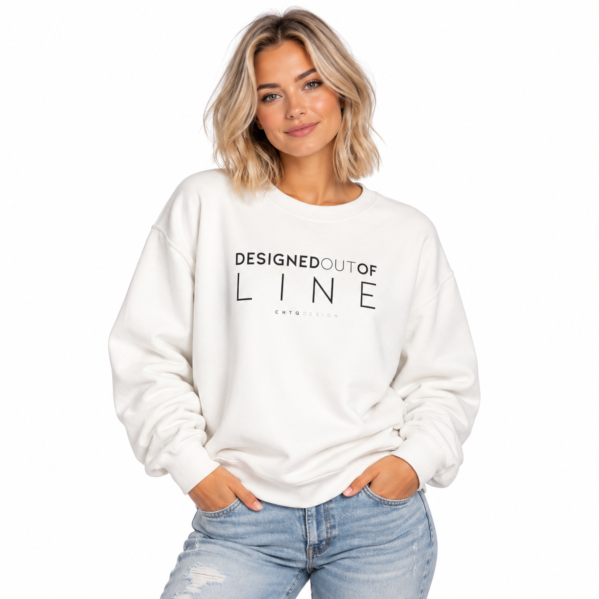 Woman wearing a white Designed Out of Line crewneck sweatshirt by CHTQ Design with black graphic text.