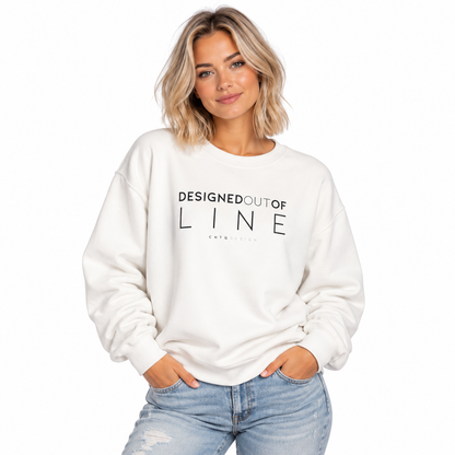 Woman wearing a white Designed Out of Line crewneck sweatshirt by CHTQ Design with black graphic text.