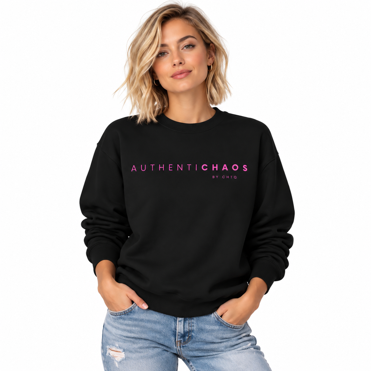 A woman modeling a black crewneck sweatshirt with 'AUTHENTICHАОS by CHTQ' printed in pink across the chest, paired with light blue jeans, against a plain white background.
