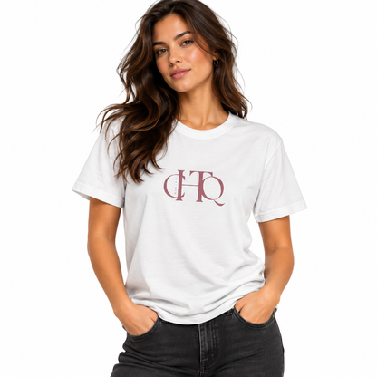 Woman wearing a white CHTQ Design graphic T-shirt with minimalist front monogram