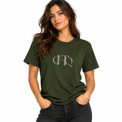 Woman wearing a military green CHTQ Design graphic T-shirt with minimalist front monogram