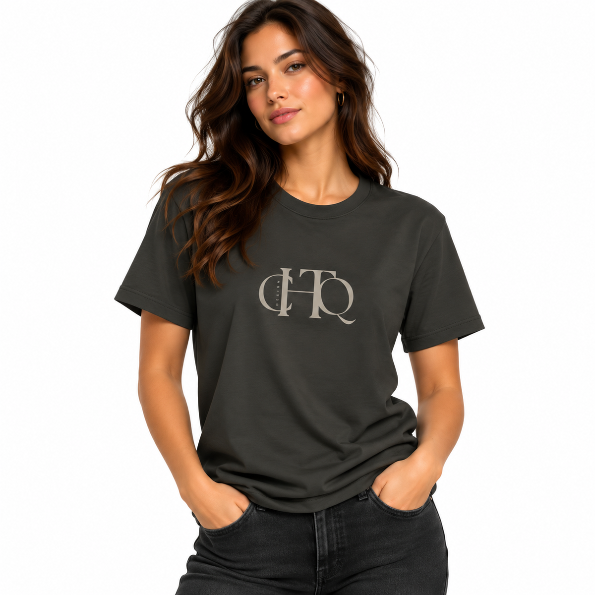 Woman wearing a heavy metal CHTQ Design graphic T-shirt with minimalist front monogram