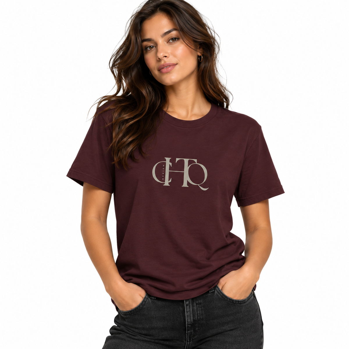 Woman wearing a maroon CHTQ Design graphic T-shirt with minimalist front monogram