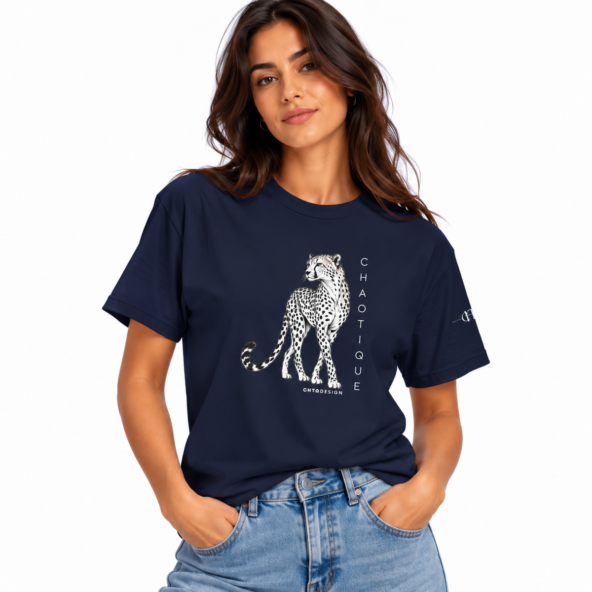 Woman wearing a navy CHAOTIQUE graphic T-shirt with hand-drawn cheetah illustration and vertical CHAOTIQUE text, styled with light blue jeans.