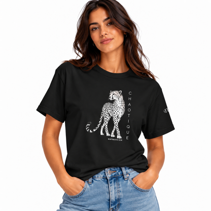 A woman wearing a black short-sleeve graphic T-shirt with a white cheetah illustration and vertical 'CHAOTIQUE' text, paired with light blue jeans, against a plain white background.