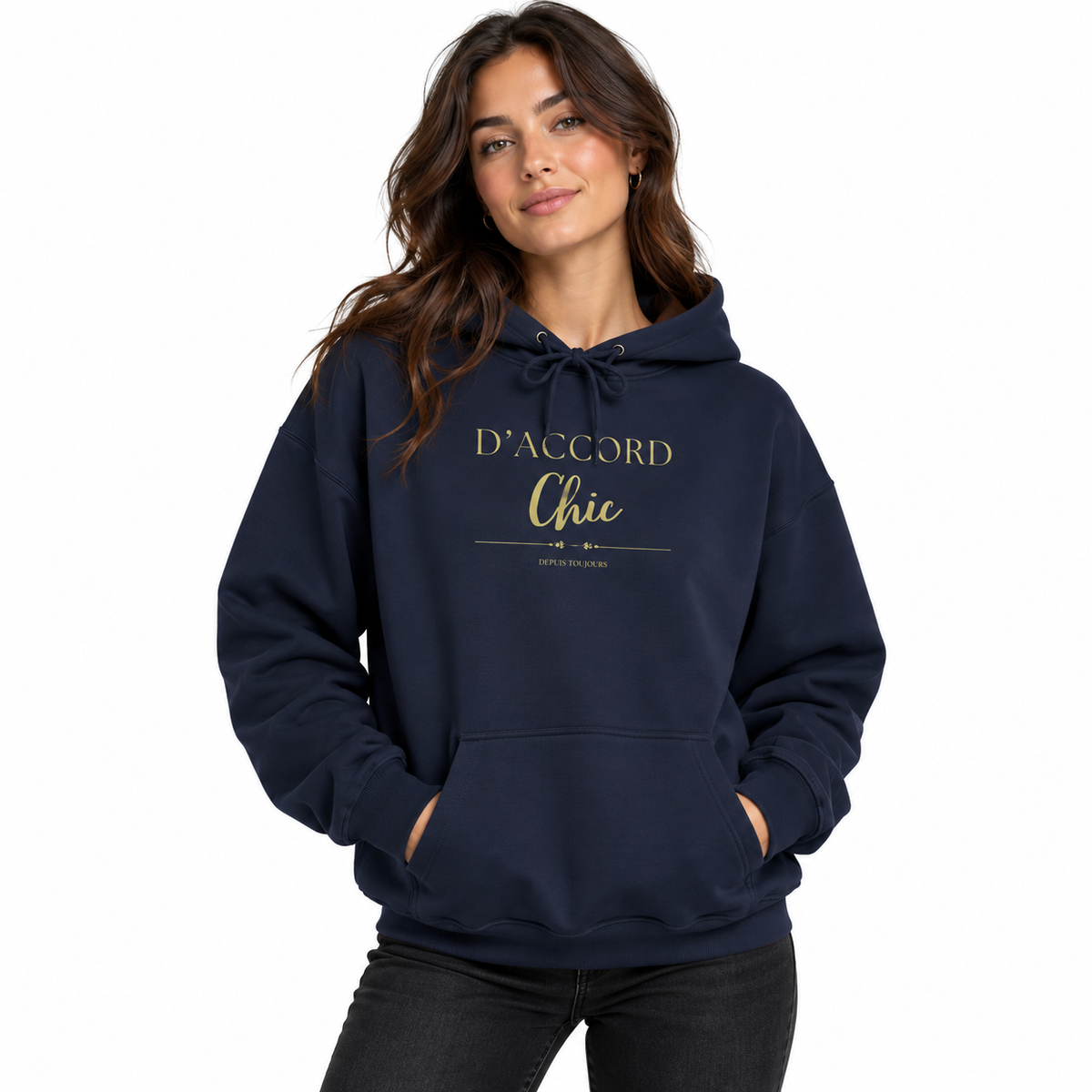 A woman wearing a navy blue pullover hoodie with 'D'ACCORD Chic' printed in gold on the chest, paired with black jeans, against a plain white background.