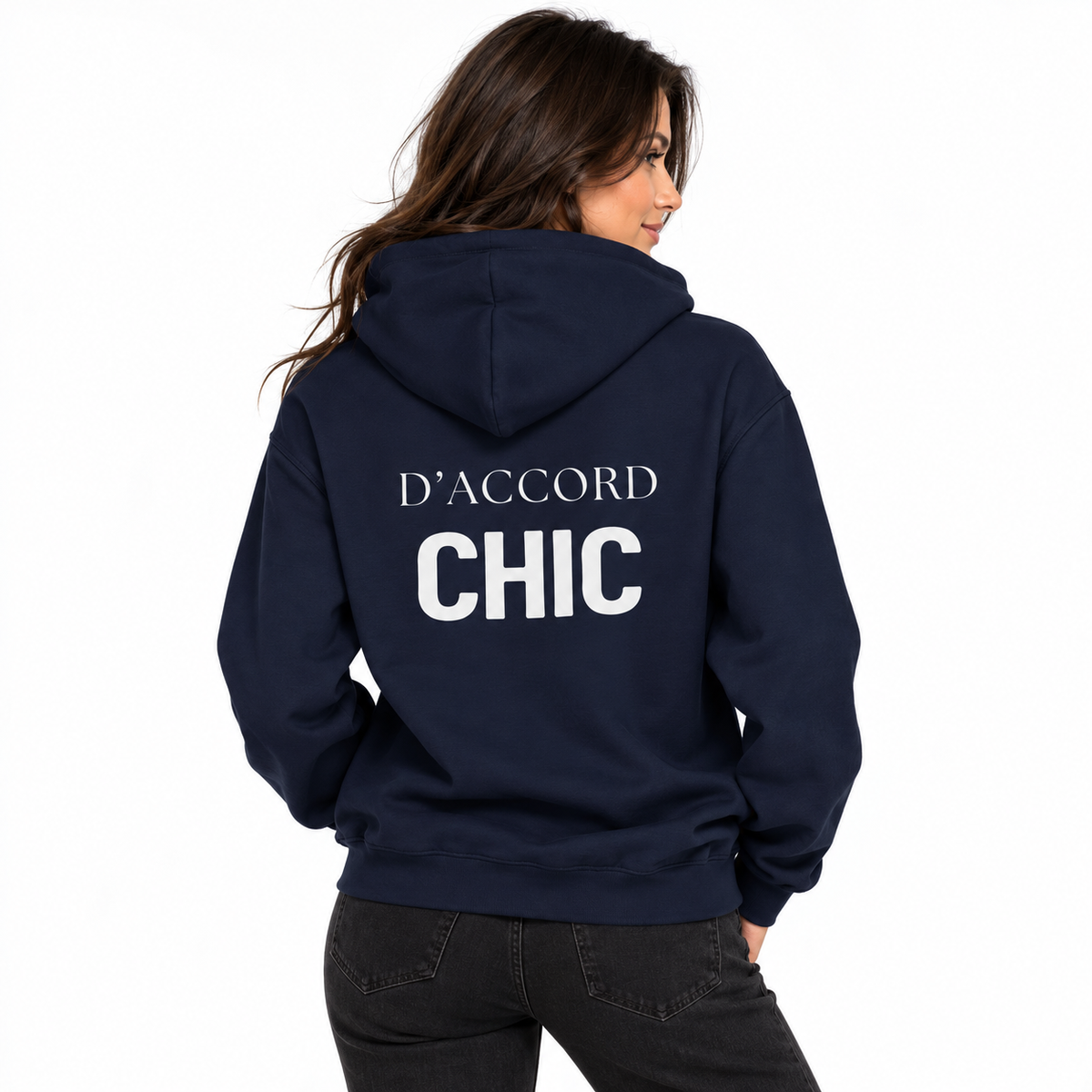 A woman shown from the back wearing a navy blue hoodie with 'D'ACCORD CHIC' printed in white across the back, paired with dark gray jeans against a plain white background.