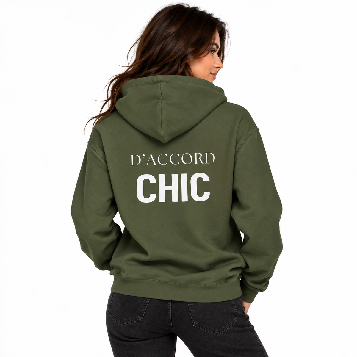 A woman shown from the back wearing an olive green hoodie with 'D'ACCORD CHIC' printed in white across the back, paired with black jeans against a plain white background.