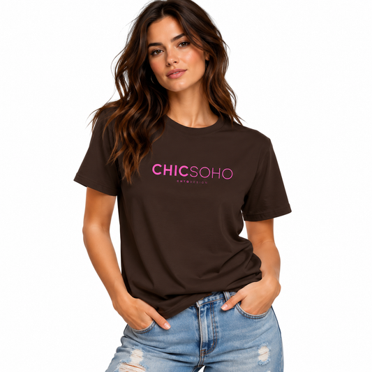 A woman wearing a dark brown short-sleeve t-shirt with 'CHICSOHO' printed in pink on the chest, paired with light-wash distressed blue jeans, against a plain white background.